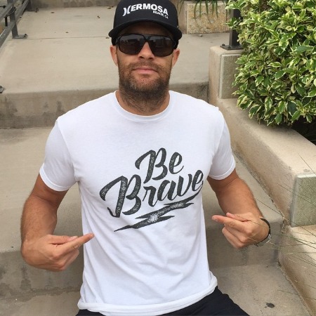 Geoff Stults is posing for the photo.